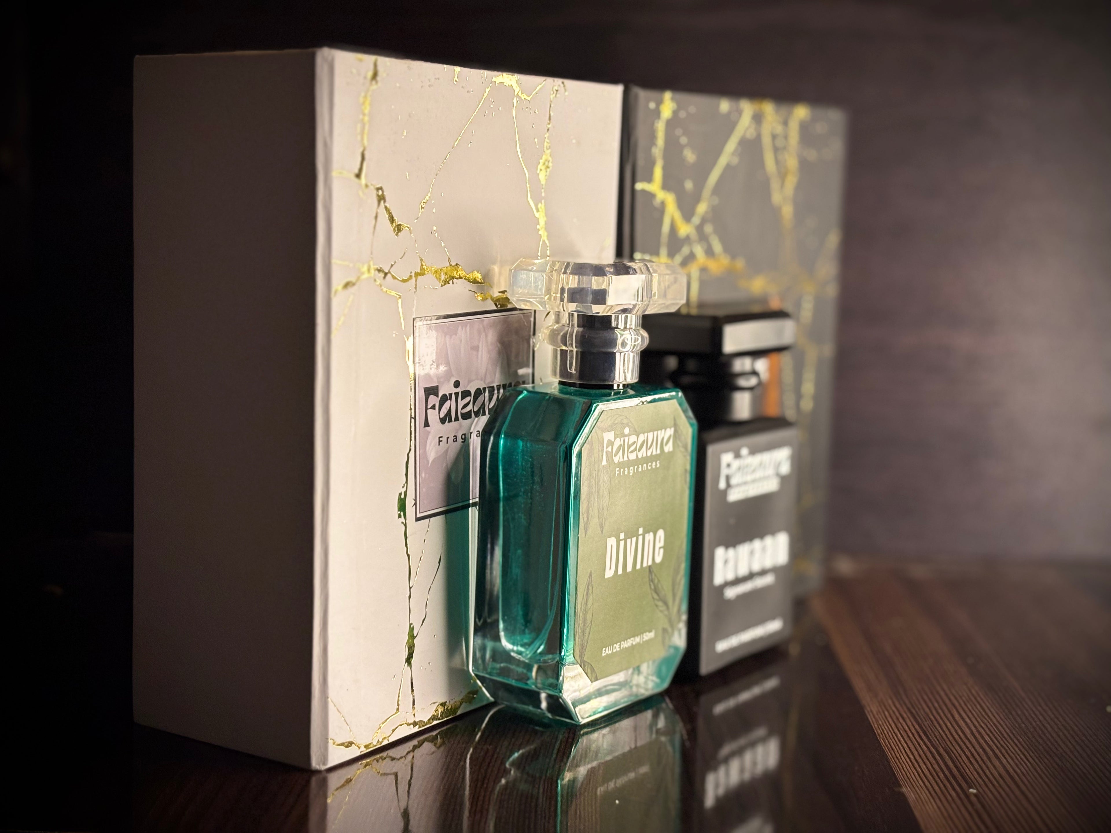 Faizaura Fragrance Rawaan & Divine perfume bundles in 50ml bottles, featuring elegant glass bottles with decorative caps.